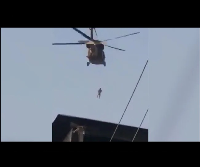 taliban-militants-fly-us-chopper-with-body-hanging-from-rope-video-surfaces