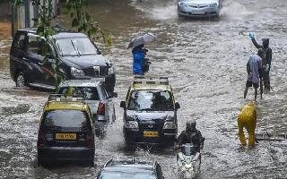 Waterlogging in Chembur, Sion, local trains halted as heavy rainfall batters Mumbai; IMD issues weather warning for 5 days
