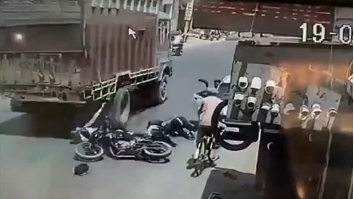 Biker Thrashed By Moving Truck Due To Carelessness Of Car Driver; Cop Shares Video | Watch