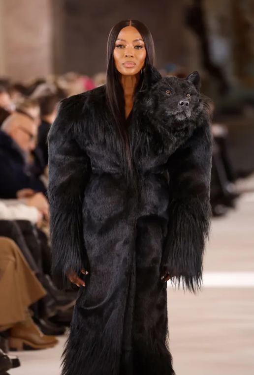 Naomi Campbell models a black wolf head dress on the Schiaparelli runway