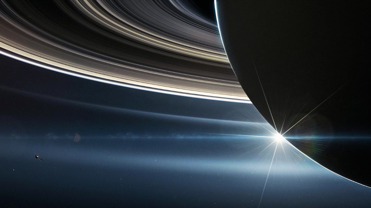 The beautiful planet Saturn, with rings, and the Sun in the distance.  Elements of this image were furnished by NASA Stock Photo - Alamy