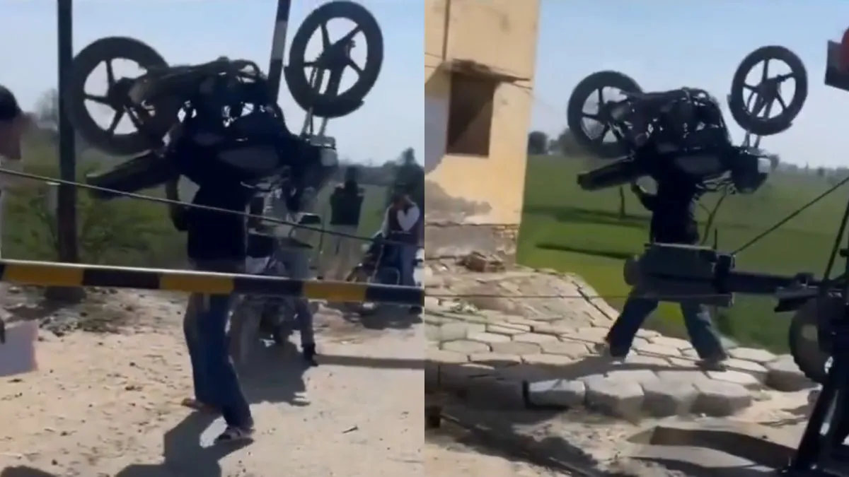 ironman-man-hoists-bike-onto-his-shoulders-to-cross-railway-barrier-viral-video-leaves-internet-in-shock