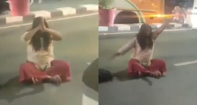 unusual-scene-in-lucknow-woman-sits-in-middle-of-road-shakes-head-for-20-minutes-viral-video-baffles-netizens
