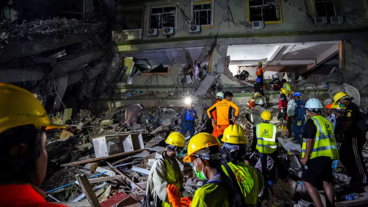  Rescue personnel work at the site of a building that collapsed, following a strong earthquake, in Bangkok
