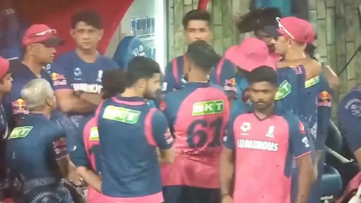 dc-vs-rr-ipl-2025-sanju-samson-ignores-rahul-dravid-during-team-huddle-viral-video-sparks-speculation-of-rift-in-rr-setup-watch