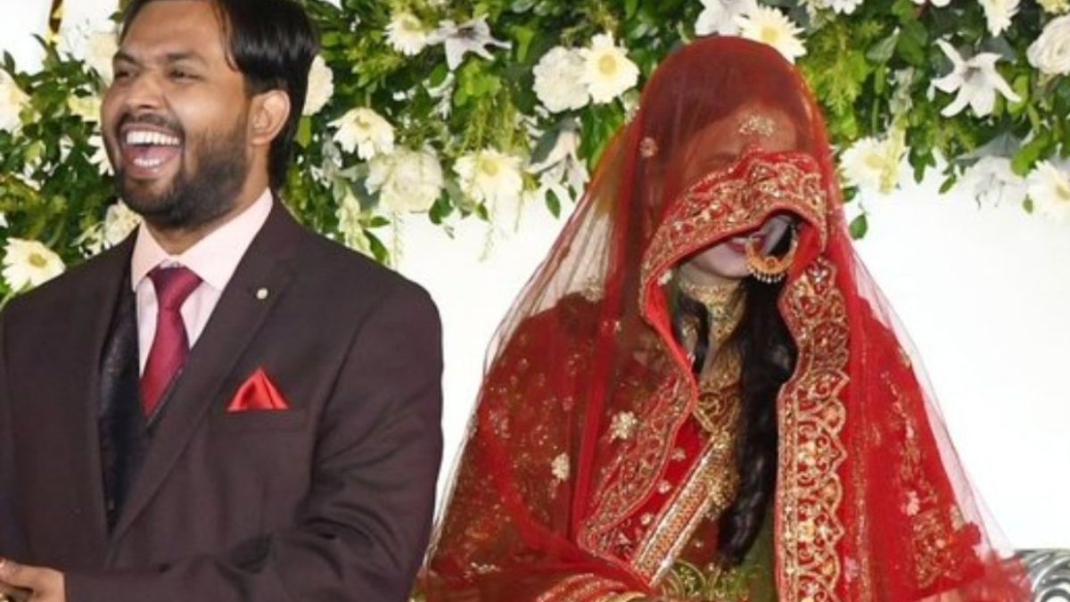Khan sir s wife as khan wows in red lehenga with veil at reception