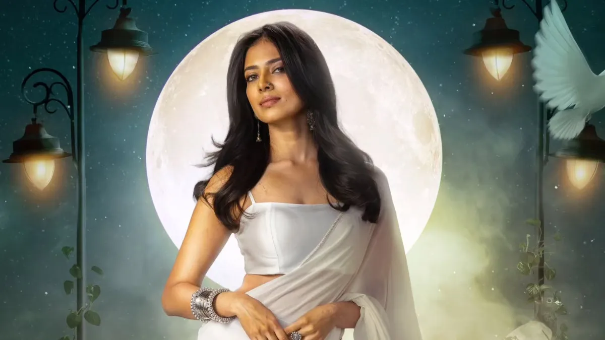the-raja-saab-malavika-mohanan-shines-in-mystical-white-saree-first-look-poster-of-prabhas-telugu-horror-comedy