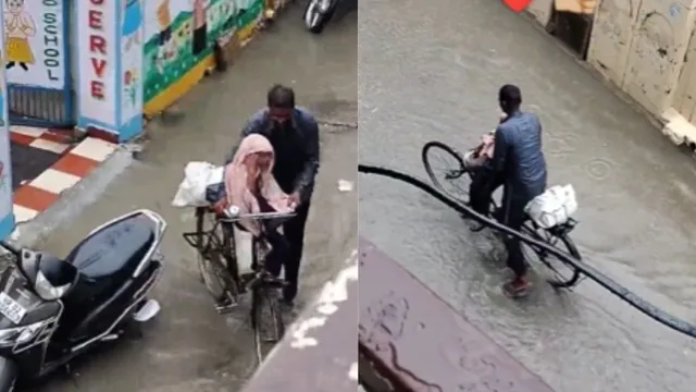 heartwarming-father-picks-daughter-from-school-in-rain-on-bicycle-wraps-her-up-in-towel-while-gets-wet-himself-viral-video