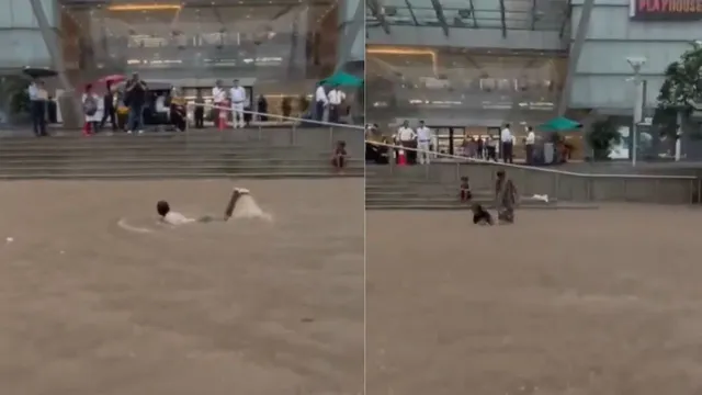 mumbai-kids-enjoy-swimming-in-waterlogged-streets-outside-mall-netizens-call-it-too-much-viral-video