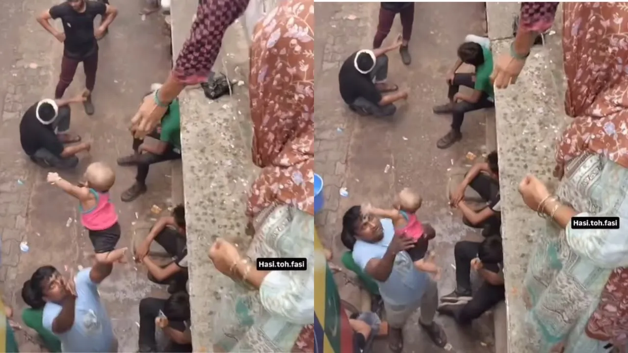 woman-tosses-child-from-terrace-into-man-arms-in-viral-video-netizens-ask-baccha-blinkit-se-mangwaya-kya