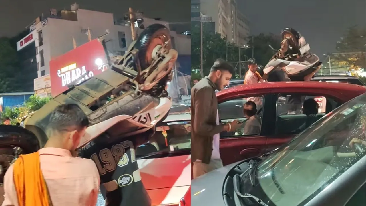 gurugram-man-lifts-scooter-on-shoulder-to-escape-endless-traffic-in-viral-video-netizens-joke-lagta-hai-papa-ka-miss-call-aaya-hai