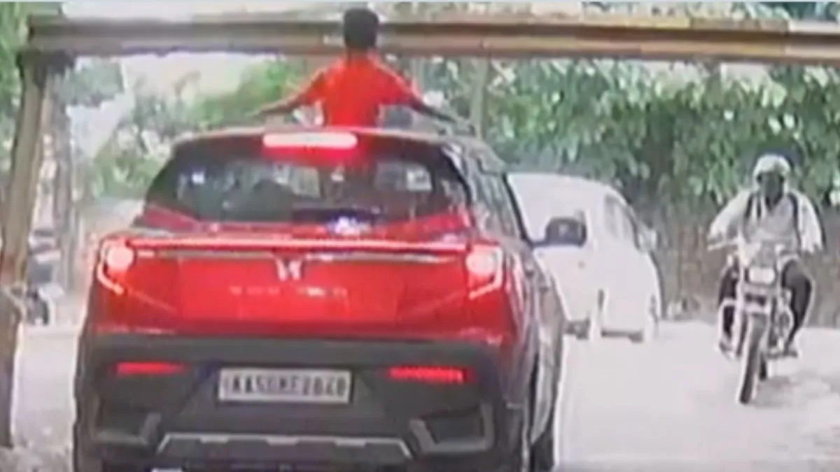 bengaluru-viral-video-boy-hit-by-overhead-barrier-while-standing-through-suv-sunroof-watch