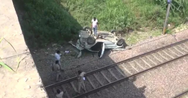 delhi-speeding-car-loses-control-falls-off-mukarba-chowk-flyover-to-land-on-tracks-near-haiderpur-metro-video