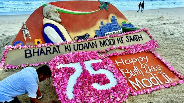 sand-artist-sudarsan-pattnaik-celebrates-pm-modi-75th-birthday-with-stunning-750-lotus-sand-art-in-odisha