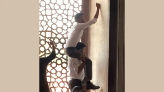 visitors-caught-scratching-names-on-walls-of-humayun-tomb-in-viral-video-internet-is-furious