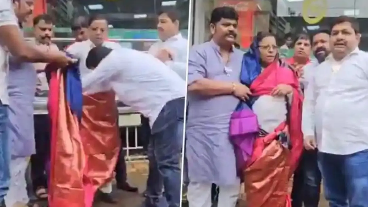 bjp-workers-forcibly-dress-congress-leader-in-saree-over-his-objectionable-post-on-pm-modi