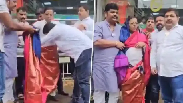 bjp-workers-forcibly-dress-congress-leader-in-saree-over-his-objectionable-post-on-pm-modi
