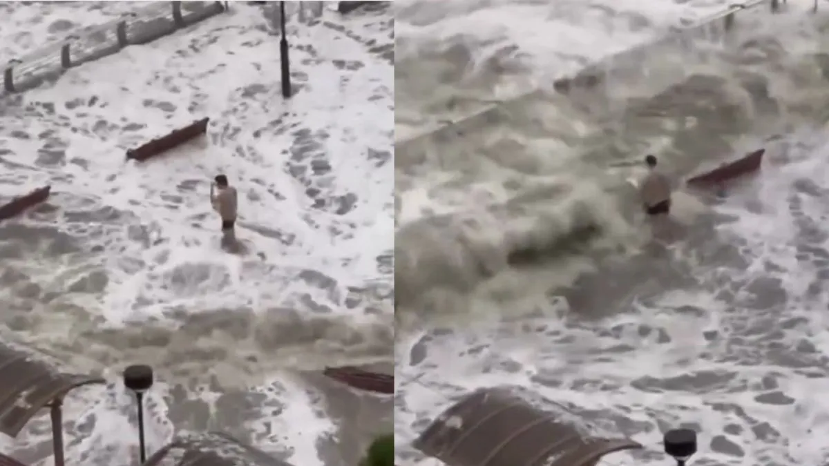 Caught On Camera: Man Seen Standing Unfazed Amid Surging Waters As ...