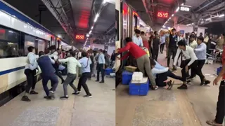 IRCTC Staff Of Vande Bharat Beat Each Other With Belts And Dustbins At Nizamuddin Station In Viral Video