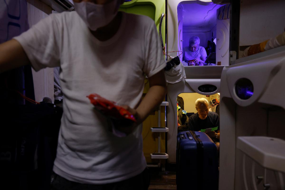 Residents live in "coffin" homes, with each compartment measuring approximately three feet by six feet, in Hong Kong