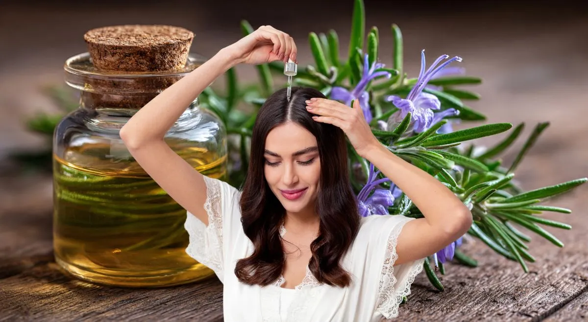 woman applying rosemary oil to scalp for hair fall