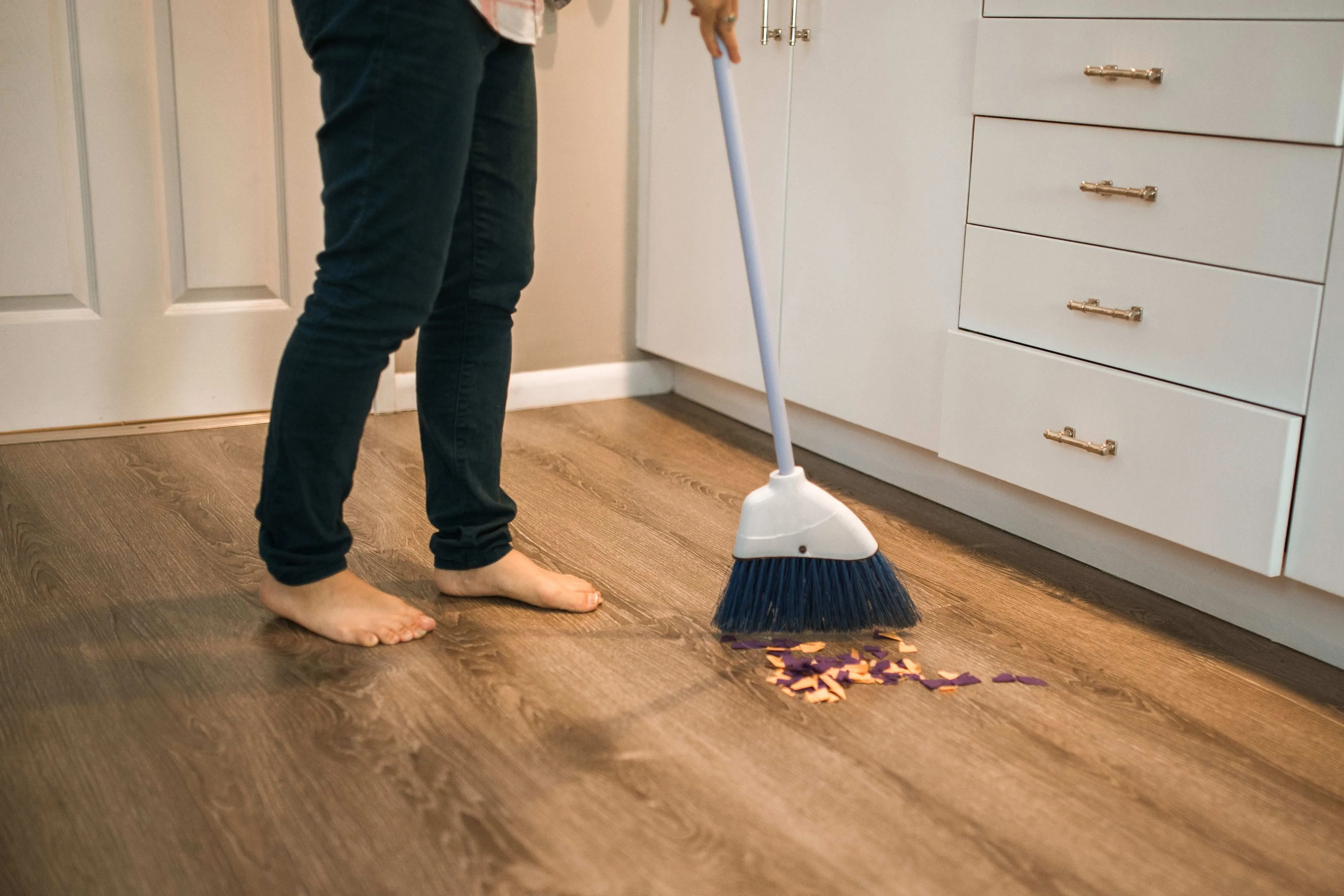 sweeping the floor and mopping