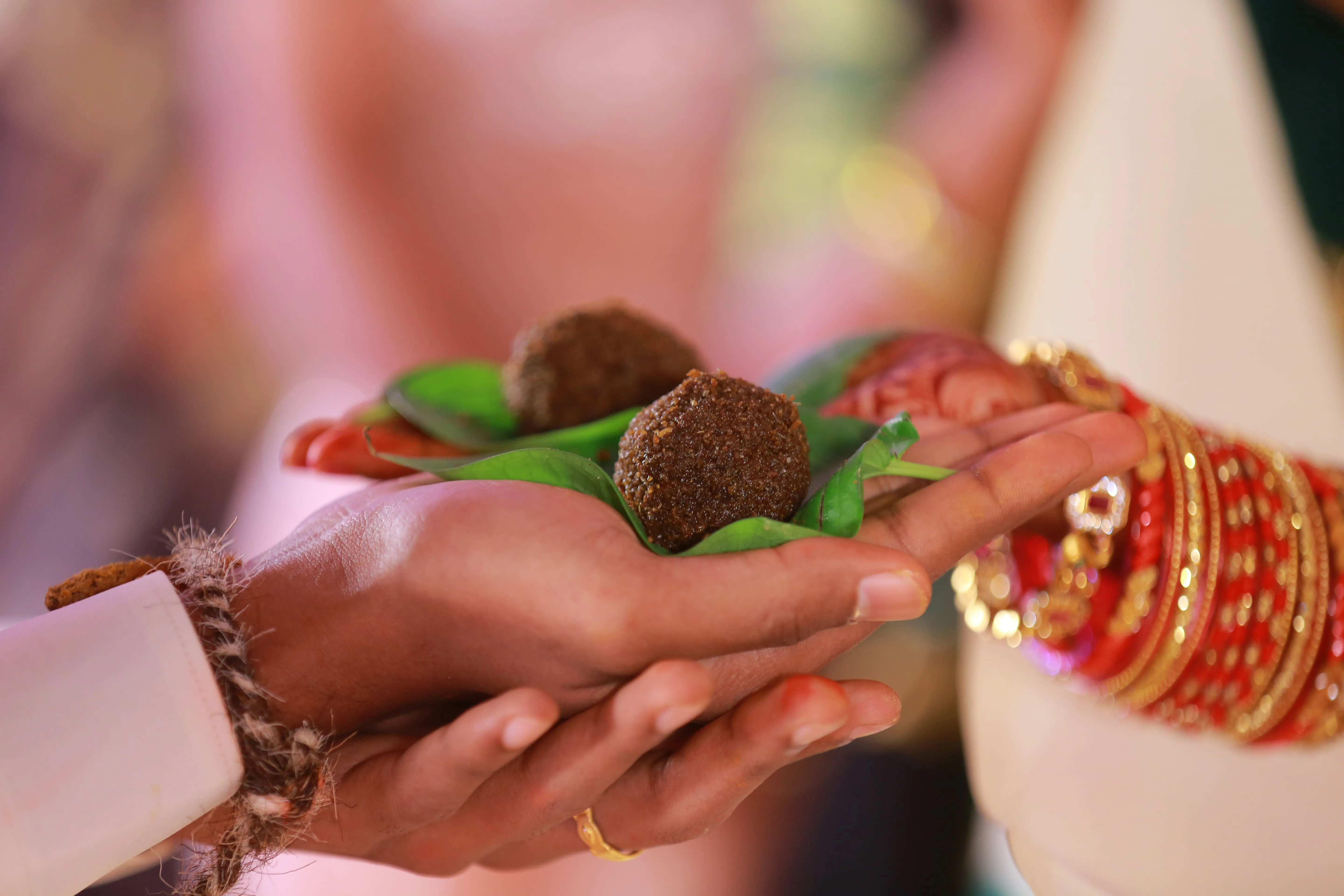 prasad taken from both hands