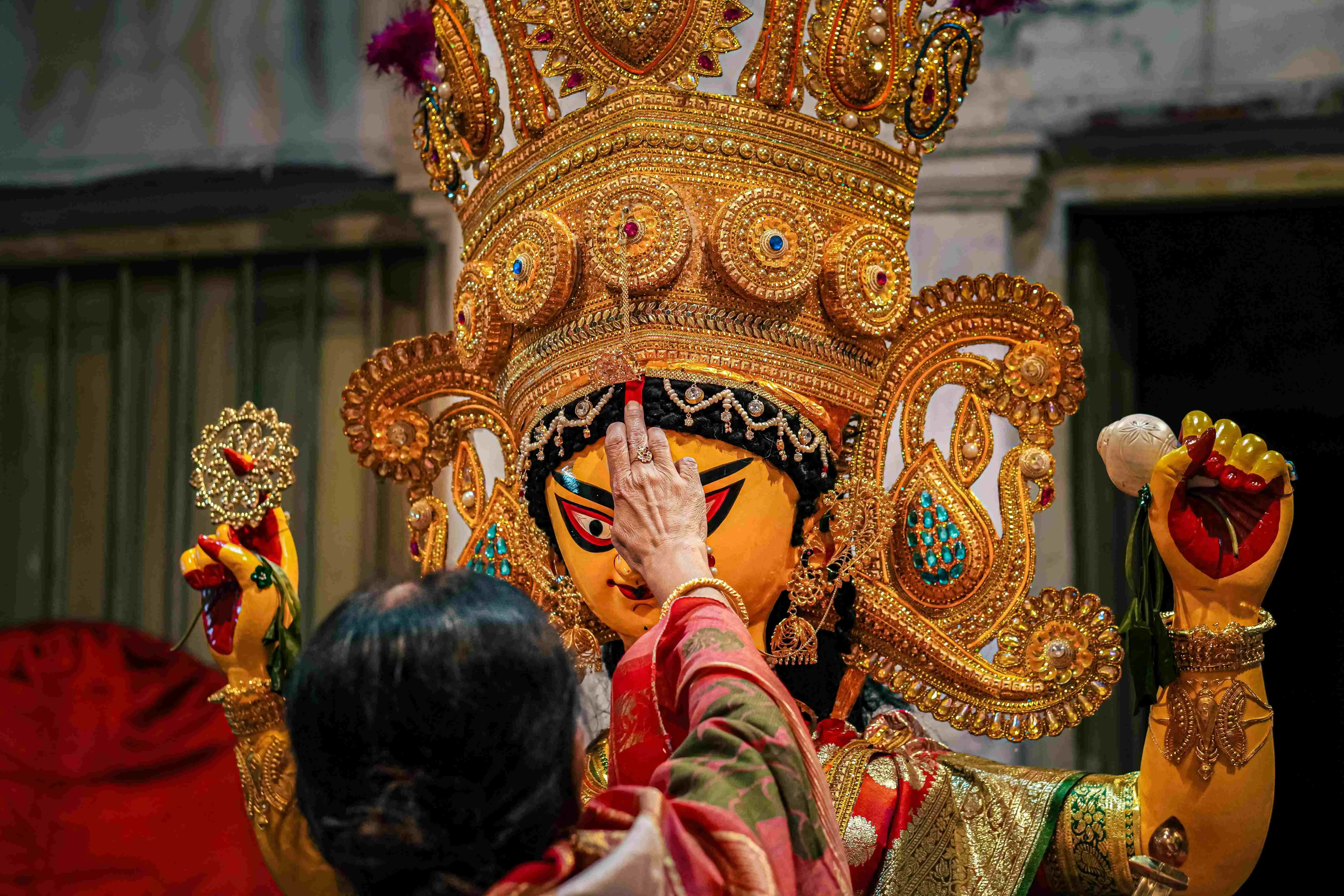 Never touch anything related to the deity inside the sacred place
