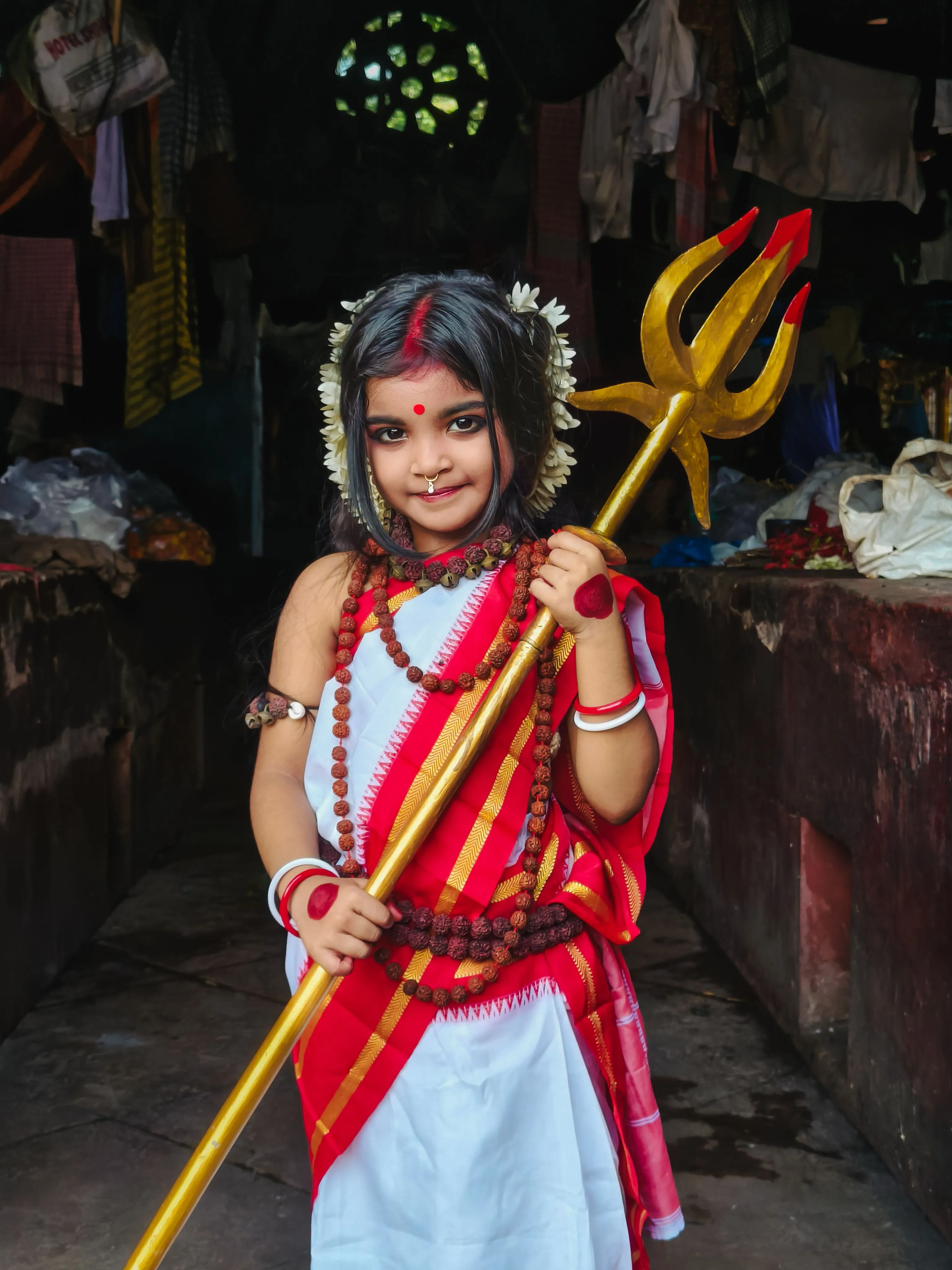 girlchild dressed as durga