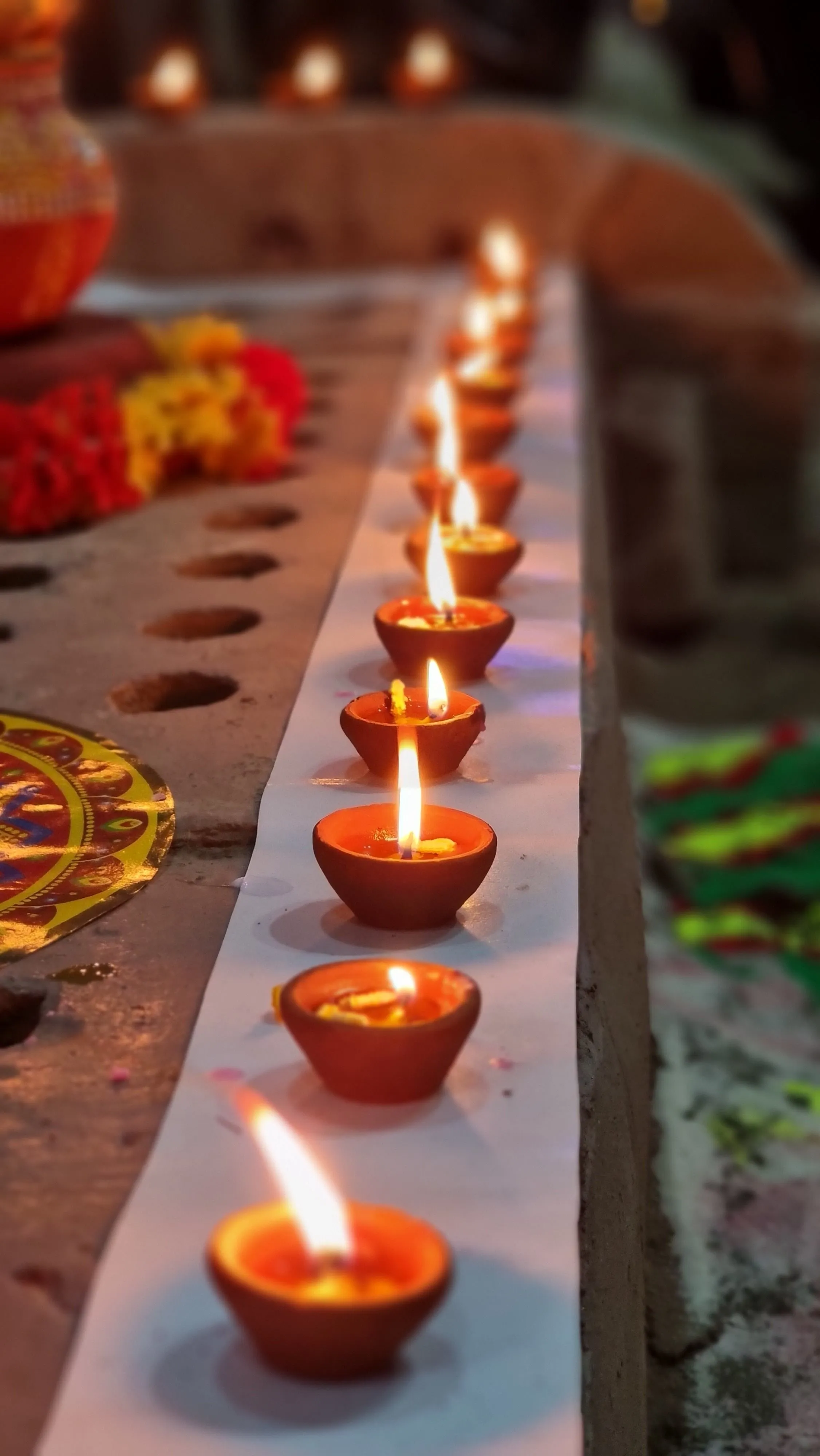 Never place the lit diya